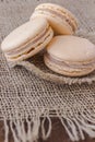 Three macaroni cake on the burlap. Top view