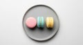 Three macarons rest on a simple Royalty Free Stock Photo