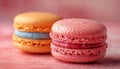 three macarons sitting on top of a pink surface Royalty Free Stock Photo