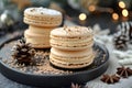 Three macarons stacked on black plate, a sweet baked goods dish Royalty Free Stock Photo