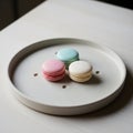 Three macarons, stacked vertically, are displayed Royalty Free Stock Photo