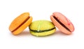 Three macaroons on white background