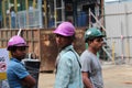 Three male construction workers at a construction site