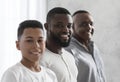 Three Male Generations. Smiling African Son, Father And Grandfather Posing To Camera Royalty Free Stock Photo