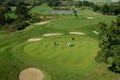 Rolling hills and a green on a golf course