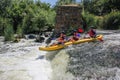 Three man white water kayaking on the river, extreme and fun sport at tourist attraction. Royalty Free Stock Photo