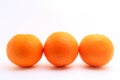 Three mandarin oranges shot over white background Royalty Free Stock Photo