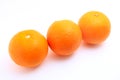 Three mandarin oranges shot over white background Royalty Free Stock Photo