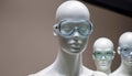 Three mannequins wearing blue goggles Royalty Free Stock Photo