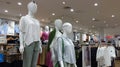 three mannequins wearing the latest clothes in Uniqlo Clothing store