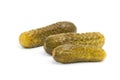 Three marinated pickled cucumbers isolated