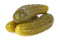Three marinated pickled cucumbers on white background