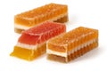 Three marmalade fruit candies on white