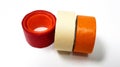 Three masking tapes roll red, white, and orange isolated on white background Royalty Free Stock Photo