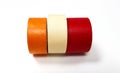 Three masking tapes roll red, white, and orange isolated on white background. Royalty Free Stock Photo