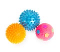 Three massage rubber balls with thorns pink, blue, yellow isol