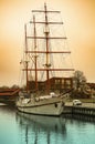 Three-masted sailing schooner moored at the pier Royalty Free Stock Photo
