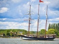 Three masted schooner Oosterschelde under sails on the Seine river for Armada exhibition in France. Cross processed Royalty Free Stock Photo