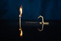 Three matches: one burned, the second is burning, and the third is broken Royalty Free Stock Photo