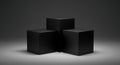 Three matte black presentation cubes are arranged on a subtle gray background Royalty Free Stock Photo