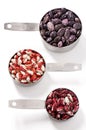 Three measuring cups with kidney beans Royalty Free Stock Photo