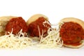Three Meatball Sliders With Sauce And Shredded Che