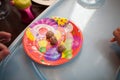 Three meatballs on a multi-colored baby plate Royalty Free Stock Photo