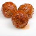 Three meatballs under meat sauce Royalty Free Stock Photo