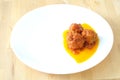 Three meatballs on a white dish, with tomato sauce Royalty Free Stock Photo