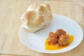 Three meatballs on a white dish with rosetta bread Royalty Free Stock Photo