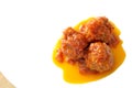 Three meatballs on a white dish, with tomato sauce Royalty Free Stock Photo