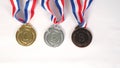 Three medals in gold silver and BRONZE medals on white background Royalty Free Stock Photo