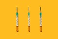 Three medical mercury thermometers in a row, close-up, flat lay