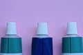 three medical metal green blue tubes with white plastic caps Royalty Free Stock Photo