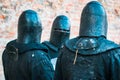 Three medieval knights in armor. The historical restoration of military events Royalty Free Stock Photo