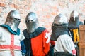 Three medieval knights in armor. The historical restoration of military events Royalty Free Stock Photo