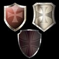 Three medieval shields on black background.