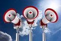 Three megaphones on sky background. Isolated 3D illustration