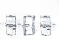 Three melting Ice cubes with Reflections on White