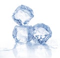 Three melting ice cubes on white background