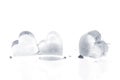 Three melting ice hearts