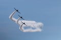 Three members of the Skytypers acrobatic airplane performance team perfoming at the Jones Beach Air Show leaving a long smoke Royalty Free Stock Photo