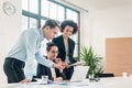 Three members of a young professional team working together Royalty Free Stock Photo