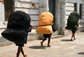 Carrying heavy bags Royalty Free Stock Photo