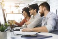 Three men enjoying good coding job on computer at modern office Royalty Free Stock Photo