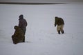 Three men fishing on ice for winter fishing Royalty Free Stock Photo