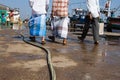 Three men in the fishing port Royalty Free Stock Photo