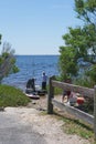 Three men prepare to launch kayaks to go fishing along the river Royalty Free Stock Photo