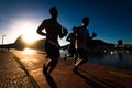 Three Men Running by Sunrise