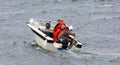 Three Men in Small BoatCatch Big Fish Royalty Free Stock Photo